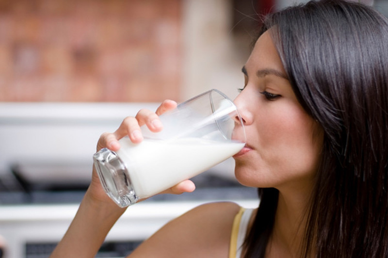 woman drinking milk needs calcium